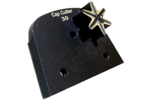 Black cap cutter tool labeled 'Cap Cutter 30' with a star-shaped cutting bit attached. Used for trimming bottle caps or similar openings.
