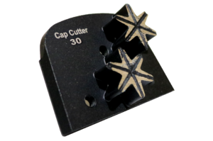 Cap Cutter 30 tool with two star-shaped cutting blades on a black base, close-up view.