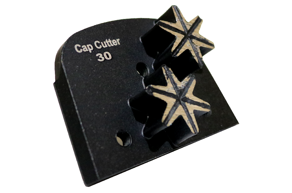 Cap Cutter 30 tool with two star-shaped cutting blades on a black base, close-up view.