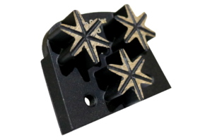 Black plastic tool block with three six-point star-shaped metal tips arranged in a row.